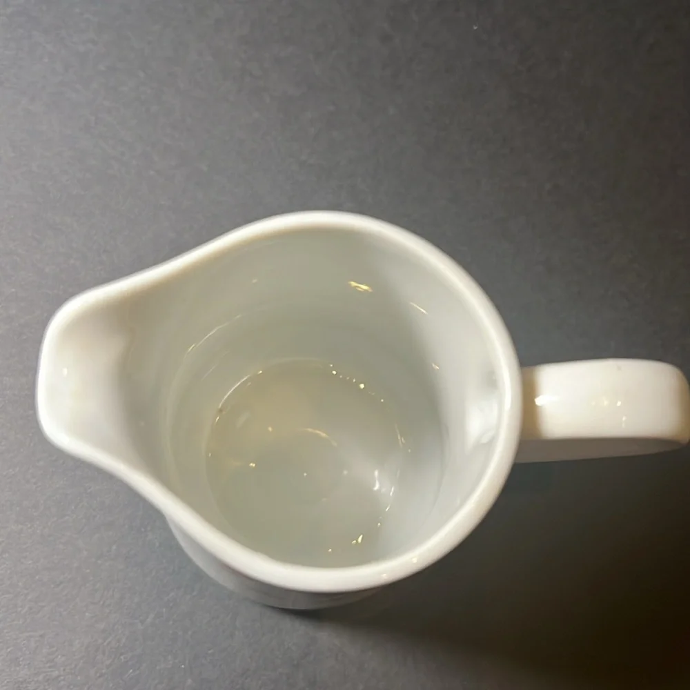 Vintage white porcelain cream‎ and sugar with floral design